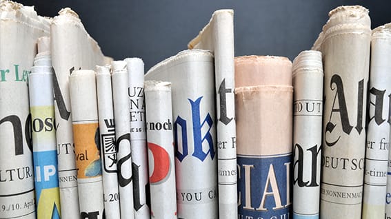 Stack of various newspapers